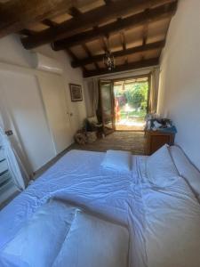 a bedroom with a large bed in a room at Villa a Capalbio in Carige Bassa +89 photos