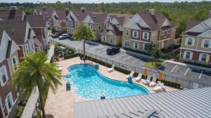 an aerial view of a pool in a residential neighbourhood at 4 Bedrooms 3 Bathrooms Summerville 2612 Ss in Orlando