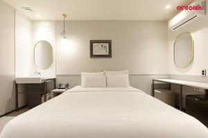 Ένα ή περισσότερα κρεβάτια σε δωμάτιο στο 넘버25호텔 양주송추점 +10 φωτογραφίες