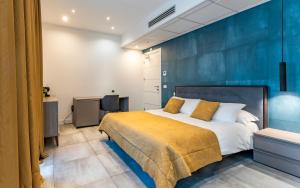 Ένα ή περισσότερα κρεβάτια σε δωμάτιο στο Mazzini Suites