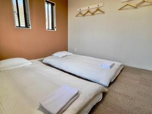 Postel nebo postele na pokoji v ubytování 富士晴 湖畔 Villas 湖景