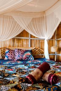 Ένα ή περισσότερα κρεβάτια σε δωμάτιο στο Poki Poki - Togian Islands