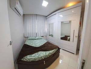 Ένα ή περισσότερα κρεβάτια σε δωμάτιο στο Apartamento 2 quartos vila velha Edifício Jacaranda 101