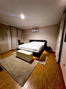 Ένα ή περισσότερα κρεβάτια σε δωμάτιο στο Canaan Apartment