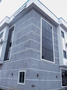 a building with stairs on the side of it at Royal Dean Hotels & Suites in Mama +7 photos