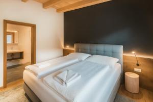 Ένα ή περισσότερα κρεβάτια σε δωμάτιο στο GLETSCHERBLICKSTUBE - AlpenLuxus Collection