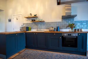 Køkken eller tekøkken på The Coachmans Quarters + 7 billeder