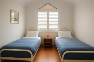 En eller flere senge i et værelse på Beach Casa + 16 billeder