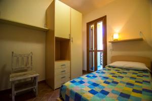 Giường trong phòng chung tại Trilocale Cielo