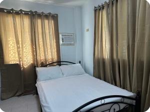 Ένα ή περισσότερα κρεβάτια σε δωμάτιο στο Cozy Home by Sol