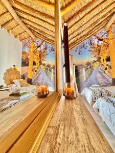 a bedroom with two beds and a window with a view at Recuerdos del Sur in El Gastor