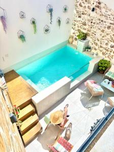 a swimming pool in the middle of a house at Recuerdos del Sur in El Gastor