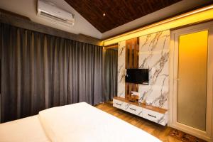 TV a/nebo společenská místnost v ubytování Floresta Farm & Resort