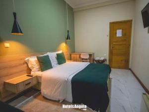 Postel nebo postele na pokoji v ubytování Milania house