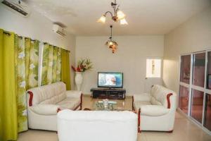 TV a/nebo společenská místnost v ubytování Milania house