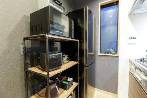 Kuchyň nebo kuchyňský kout v ubytování NAGOYA ORIGAMI STAY Futatsubashi - Vacation STAY 03730v