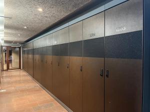 a row of lockers in a hallway in a building at Åre Stay - Nybyggd Penthouse-lägenhet I Twintip in Åre