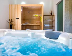 a bath tub in a room with at Villa Mosor Mit Beheiztem Salzwasserpool Und Sauna in Omiš