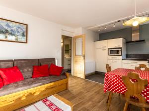 a living room with a couch and a table at Appartement 2 chambres centre village proche pistes avec Wifi - FR-1-437-60 in La Clusaz