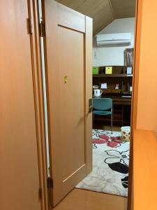 an open door to an office with a desk at ichihara homestay-stay with Japanese family - Vacation STAY 17885 in Ichihara