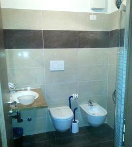 Koupelna v ubytování Hotel Canin