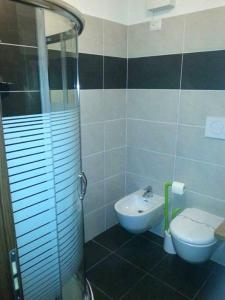 Koupelna v ubytování Hotel Canin