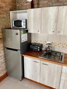 Η κουζίνα ή μικρή κουζίνα στο One Cabañas 1