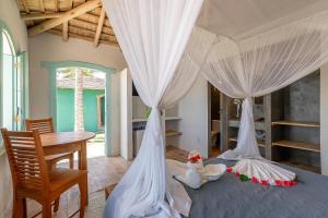 En eller flere senge i et værelse på Nuhatê Casa Hotel