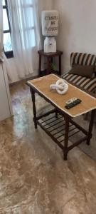 a coffee table in a living room with a couch at Casita de Norma, Mercedes Corrientes!!! in Mercedes +7 photos