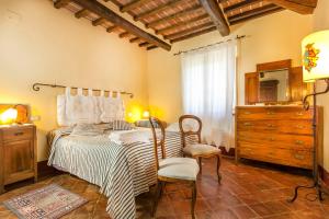 Ένα ή περισσότερα κρεβάτια σε δωμάτιο στο Holiday apartments La Bozza and Il Bozzino +73 φωτογραφίες