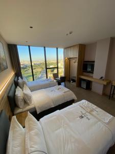 Ένα ή περισσότερα κρεβάτια σε δωμάτιο στο Rek Holiday Hotel +40 φωτογραφίες