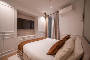 Ένα ή περισσότερα κρεβάτια σε δωμάτιο στο Architect Luxury Appartment - Marais