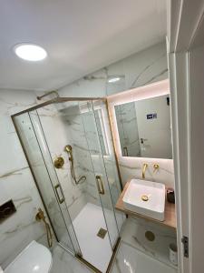 a bathroom with a shower and a sink at KS near the airport in Lisbon