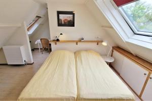 Ένα ή περισσότερα κρεβάτια σε δωμάτιο στο Hello Zeeland - JW Schuurmanstraat 4