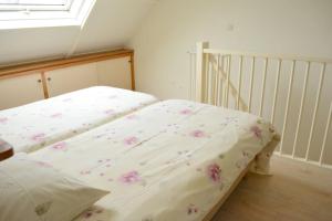 Ένα ή περισσότερα κρεβάτια σε δωμάτιο στο Hello Zeeland - JW Schuurmanstraat 4