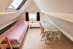 Ένα ή περισσότερα κρεβάτια σε δωμάτιο στο Hello Zeeland - JW Schuurmanstraat 4 +5 φωτογραφίες