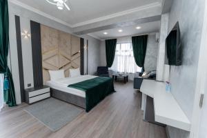 Ένα ή περισσότερα κρεβάτια σε δωμάτιο στο Chuxuryurd Hotel