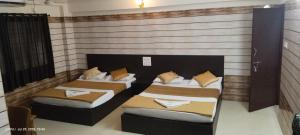 Postel nebo postele na pokoji v ubytování Hotel Adigaa Heritage + 5 fotografií