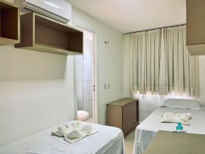 En eller flere senge i et værelse på Golf Ville By Holiday Stays