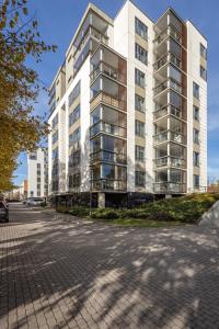 a tall white building with a street in front of it at Elite centre, free parking, ultra-desirable 1 of 1, lux view in Rīga +23 photos