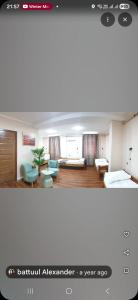 a living room with a couch and chairs in a room at Bee Happy Hostel & Gobi amazing tour in Dalandzadgad