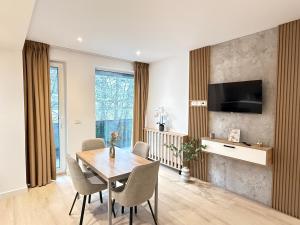 TV a/nebo společenská místnost v ubytování Vuya LOFT Aparthotel by Cozy Apartments