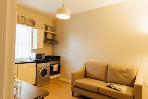 Kuchyň nebo kuchyňský kout v ubytování Malone 37 Apartments by Malone Hotel