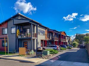 a row of houses with cars parked on a street at Hull Street Loft in Hood River