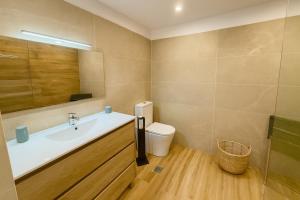 a bathroom with a sink and a toilet at SANTA BEACH in Roses