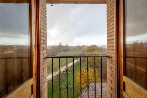 a balcony with a view of a yard at Historic Village Escape in Burgo de Osma in El Burgo de Osma
