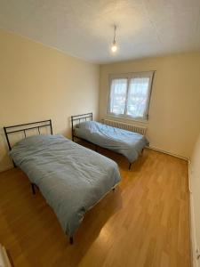 Ένα ή περισσότερα κρεβάτια σε δωμάτιο στο Belle maison 6 personnes