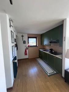 Η κουζίνα ή μικρή κουζίνα στο Chez Mati by Sunhome Fiemme