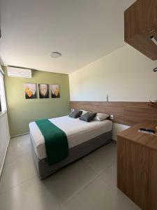 Ένα ή περισσότερα κρεβάτια σε δωμάτιο στο Gran Carlo Hotel