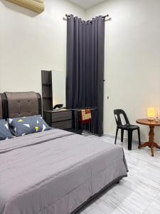 Postel nebo postele na pokoji v ubytování D 'Bukit Homestay Kok Lanas